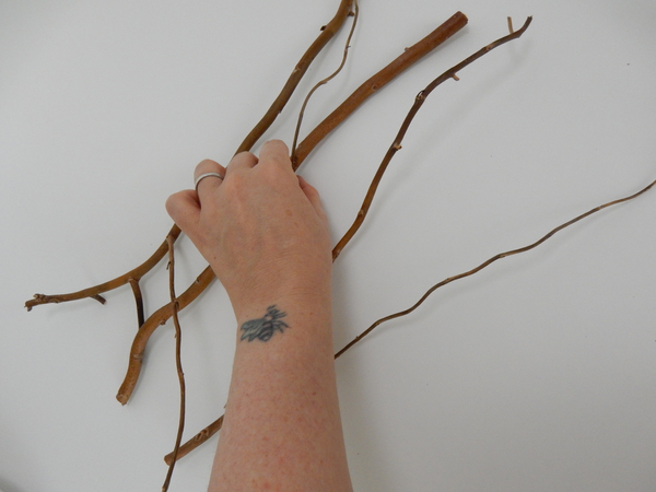 Add another twig and make sure to glue it to three other twigs.