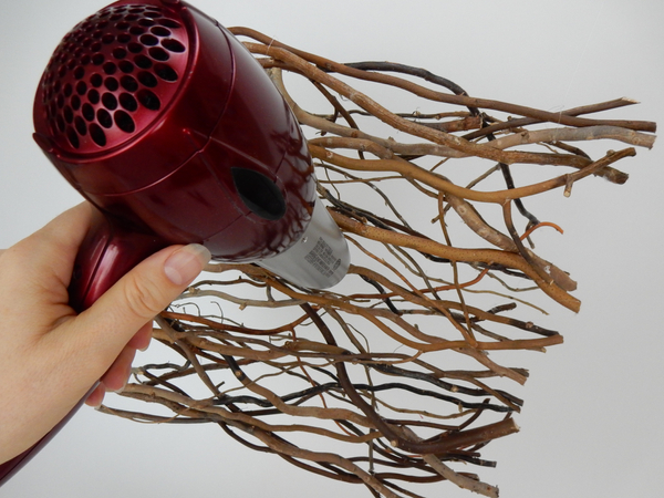 Blow any hot glue strands away with a hairdryer set on a warm setting. Blow any hot glue strands away with a hairdryer set on a warm setting.