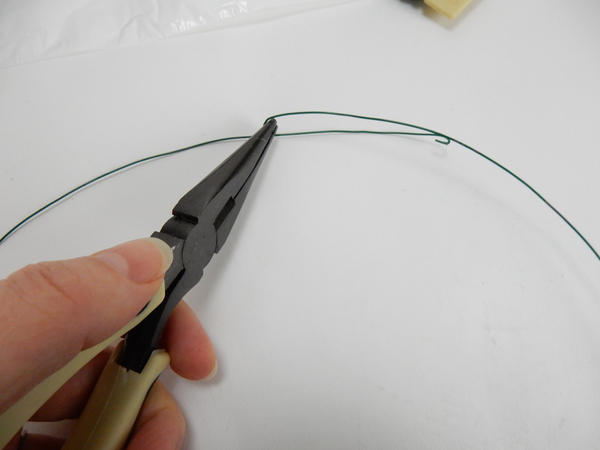 Curl the wires over at the ends to prevent it from scratching the shallow container