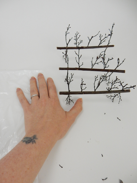 Stand the twig armatures and adjust to make sure it is balanced by snipping away some of the stick ends