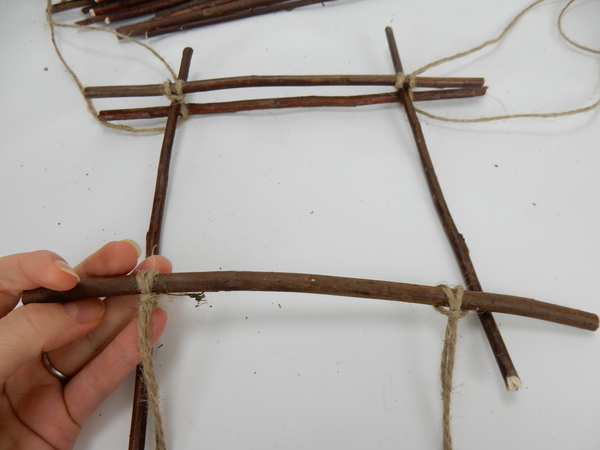 Add another twig and prepare another cross twig as you did the first
