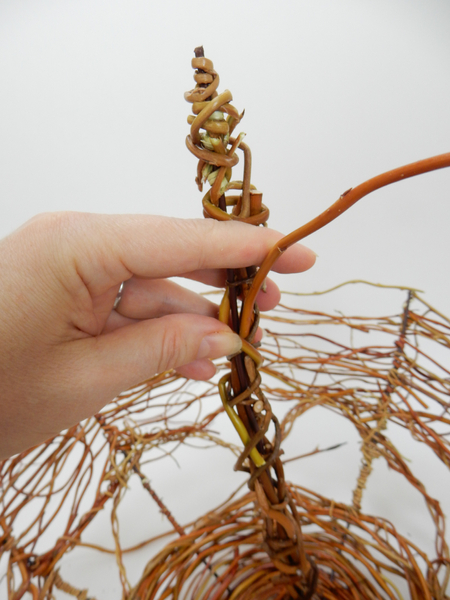 Wrap the handle with willow stems