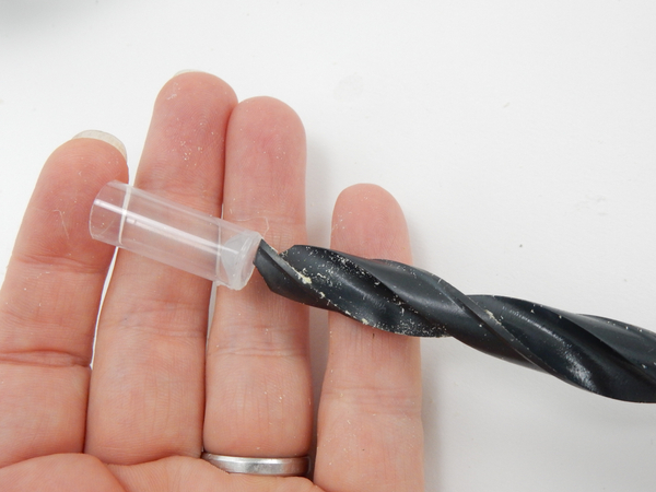 Measure a drill bit against the drinking straw tube