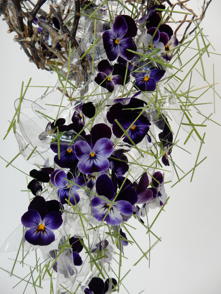 Melted plastic shapes as an armature for the pansies