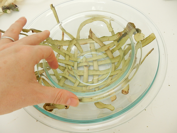 Set another bowl over the weave inside the larger bowl to press it into the dome shape Set another bowl over the weave inside the larger bowl to press it into the dome shape