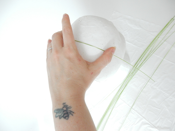 Making a hat out of grass 