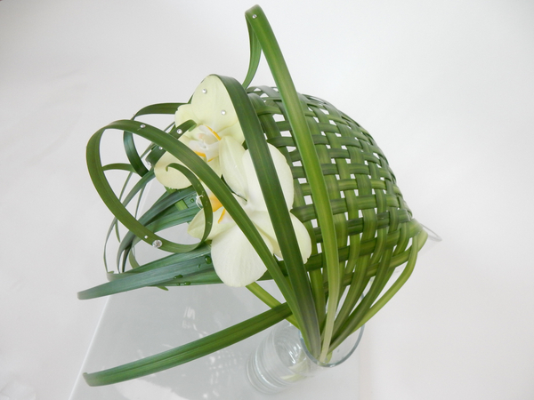 Woven lily grass in two water filled vases
