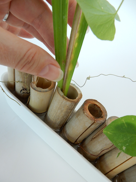 Keep the pieces in place by sliding it into any split parts of the bamboo