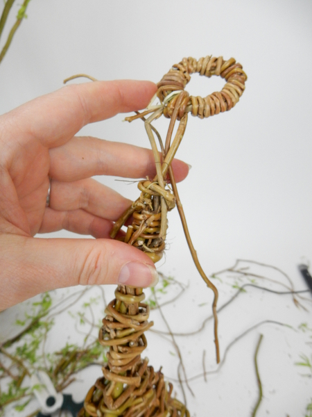 Press the looped stems into the willow nest