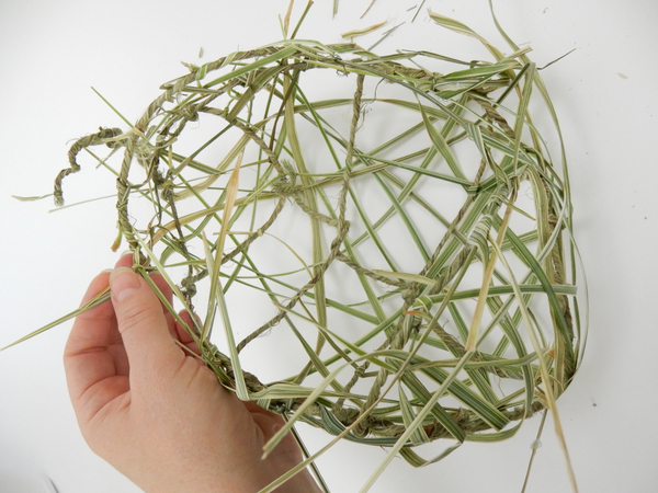 Knot and weave in grass to fill in the gaps and break up the wire and grid pattern