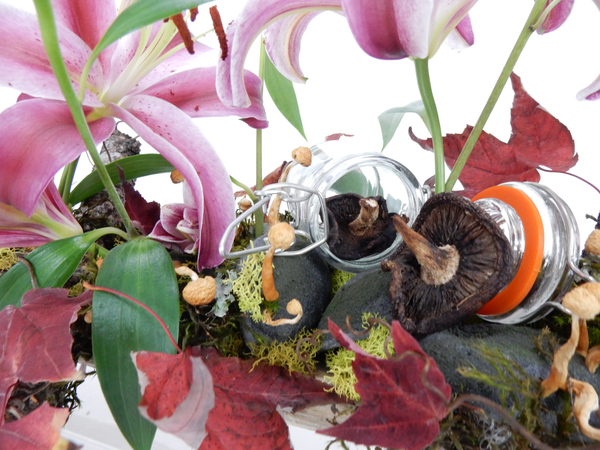 Mushroom and moss with autumn leaves and lilies