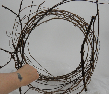 Loosen up a vine wreath to create an upright armature