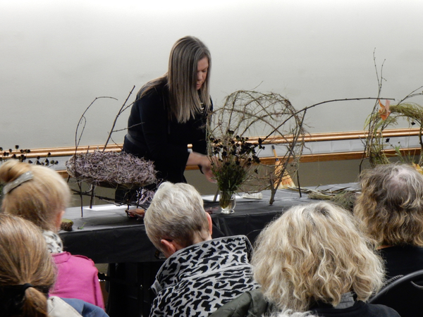 Weave delicate blades of grass between the wreath sections to fill in the cup shape.