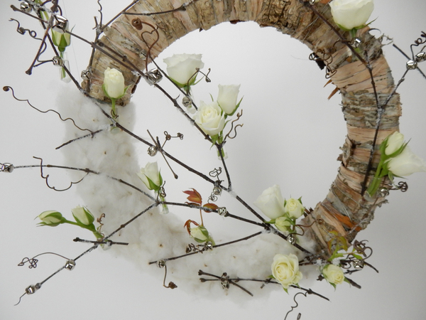 Add tiny silver bells to the wreath design