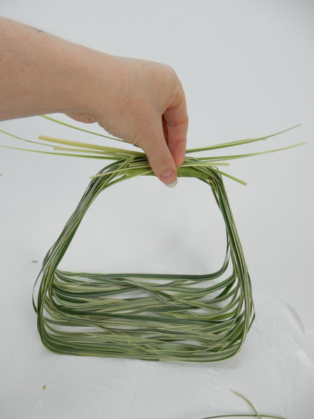 Gather up the stem ends at the handle side of the basket