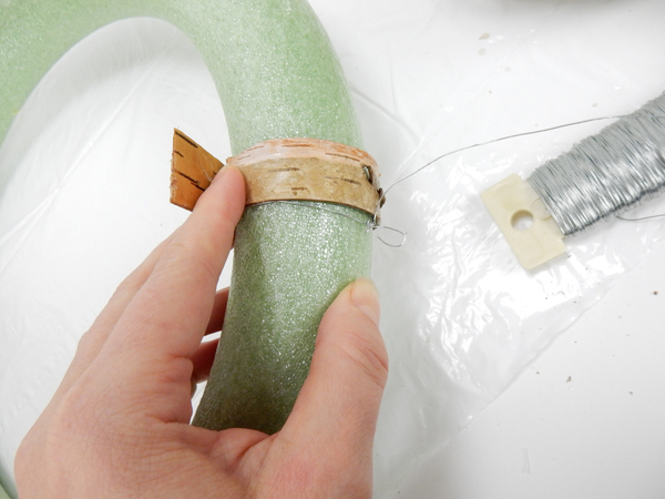 Wrap a bark strip around the wreath frame