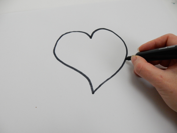 Draw a heart shape on paper