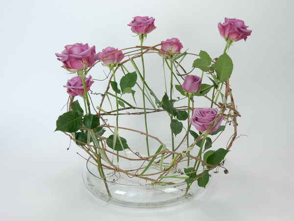 Roses in a grapevine armature Roses in a grapevine armature
