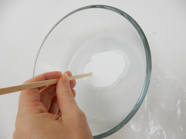 Pour wood glue in a bowl and thin with warm water