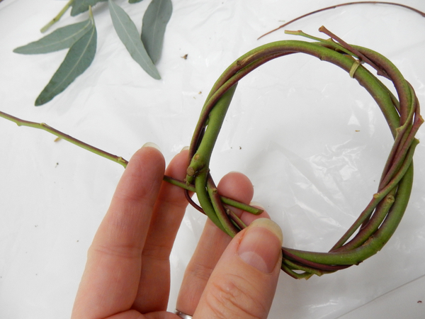 Continue to weave to create a sturdy little wreath with plenty of twigs that form small gaps all around