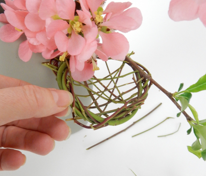 A little nest for Easter chocolates that naturally hooks over the edge of a container