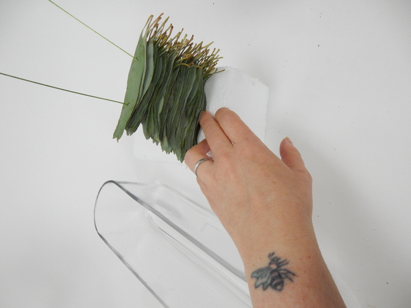 Create a stack of skewered leaves.