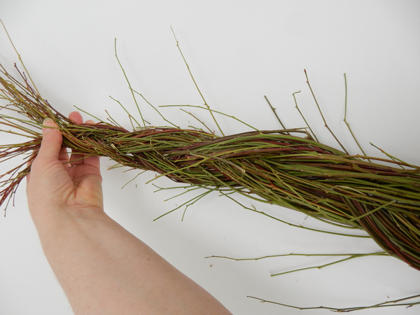 Start at the thin end and braid the stems together.