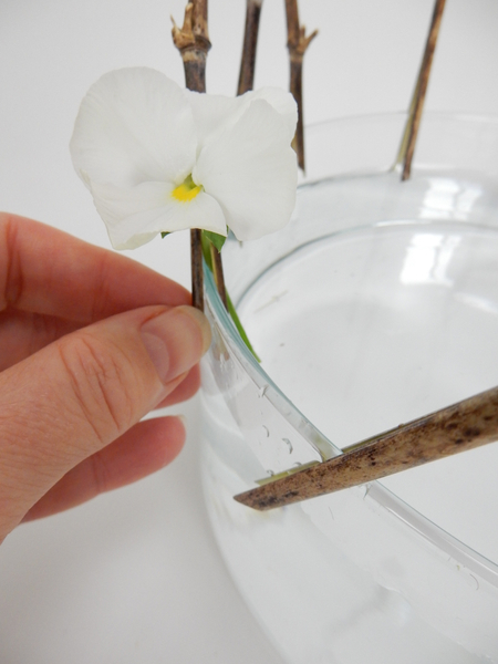  Slip in the stem to catch between the bamboo and the container.