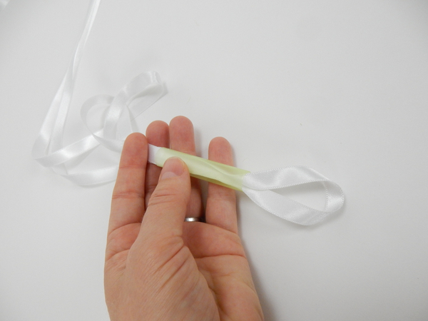 Fold a length of ribbon in half and slip it through the straw 