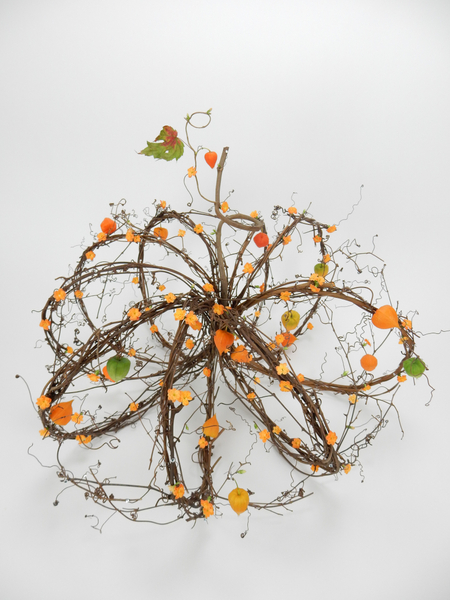 Kalanchoe and Physalis on a woven wreath pumpkin