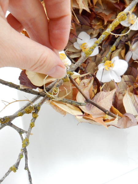 Glue the roots into the design with flower glue
