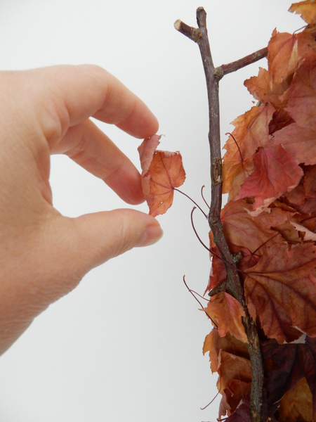 Glue in a few small leaves to extend beyond the armature