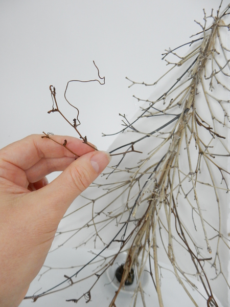 Add a few vine tendrils between the twigs