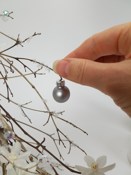 Hang a few baubles on the twig snipped branches