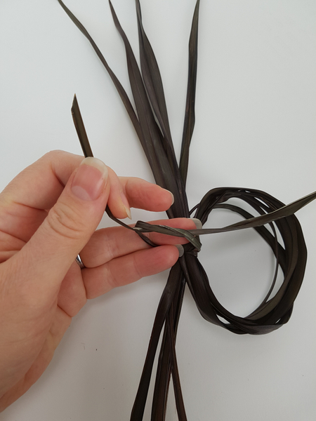Secure the flax loop with a knot