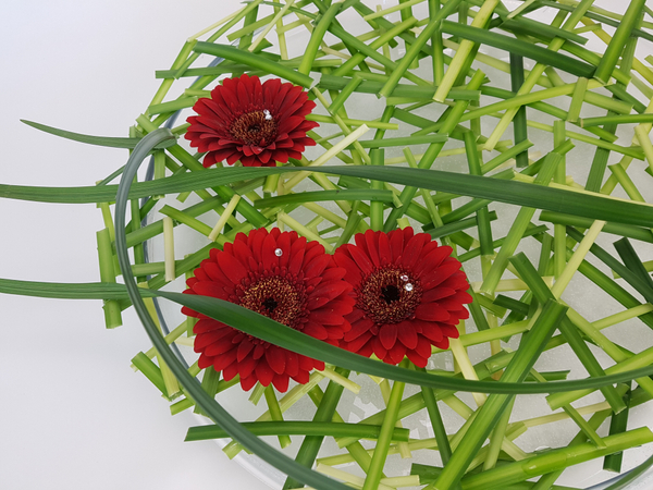 Lily grass and gerbera flower arrangement Lily grass and gerbera flower arrangement