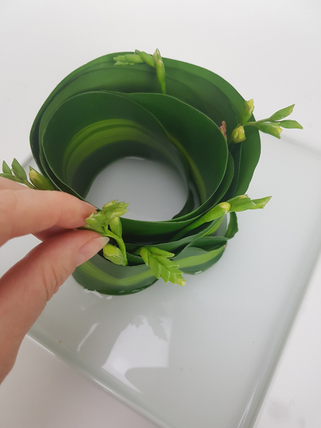 Wiggle the stems between the layers of leaf.