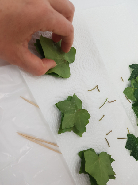 Stack the leaves.  Seven or eight leaves should be enough for each stack.