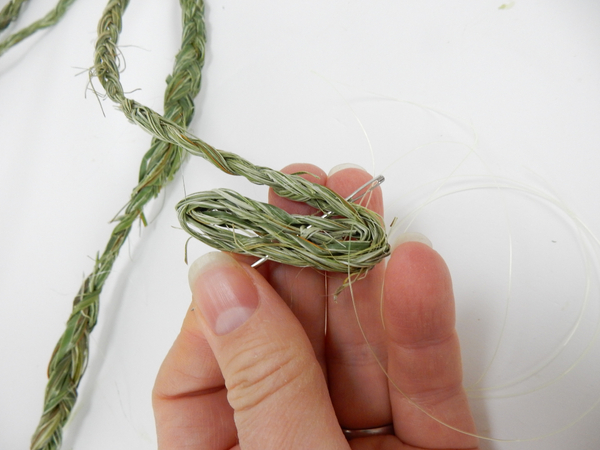 Start to coil the braided flax strand