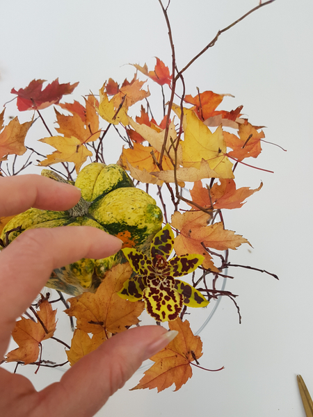 Place the fresh floral material in the water tubes.