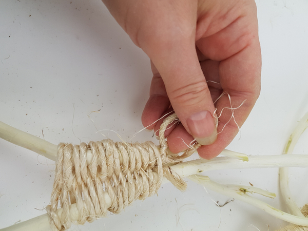 Knot the rope to secure at the end of the winding pattern