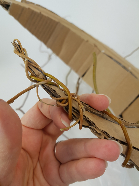 Wrap the willow to closely follow the cardboard shape