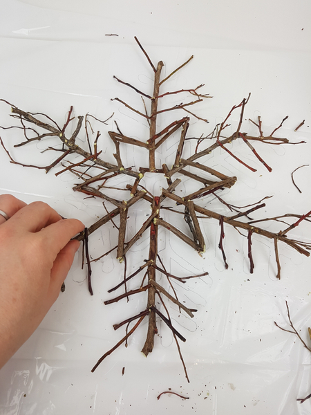 Glue in the icicles at the end of the longer twigs