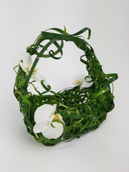 Phalaenopsis and lily grass basket