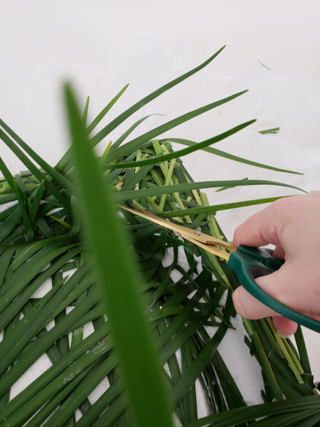 Cut any grass tips away the extend over the edge.