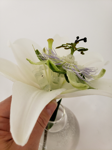 Place the flowers in the tubes so that it remains hydrated Place the flowers in the tubes so that it remains hydrated