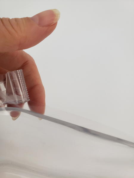 Adhere a strip of clear tape around the inside edge of your container