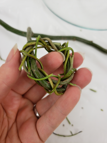 Weave the entire twig in on itself without cutting it from the main branch