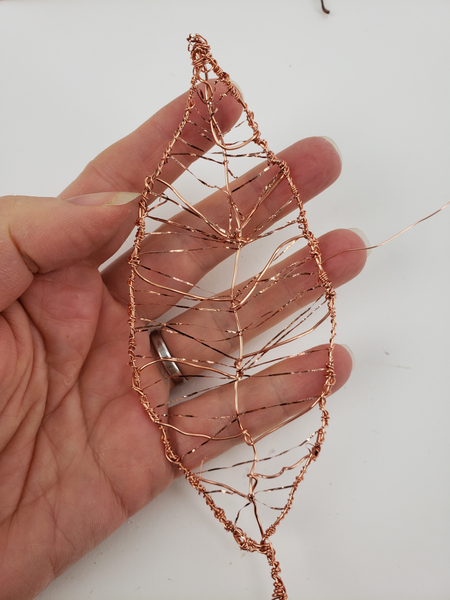 Wrap wire all the way around the leaf and the stem end to give it extra strength Wrap wire all the way around the leaf and the stem end to give it extra strength