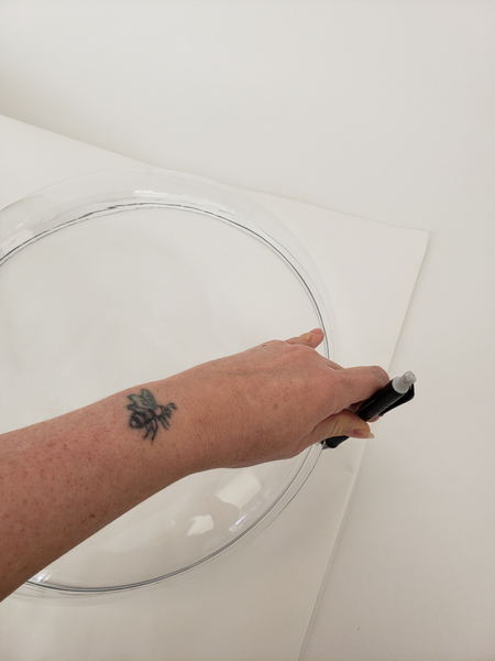 Trace a large circular shape on paper